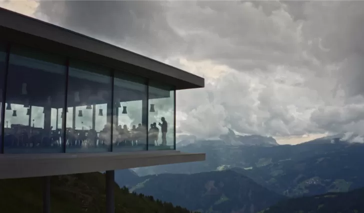 Glass encased office overlooking mountains